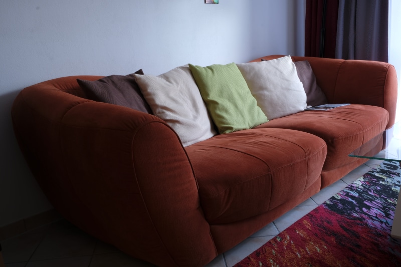 seat, chill out, quiet zone, furniture pieces, cushion, fabric, relaxation, bench, wealth, sofa, orange, indoors, home interior, duvet, absence, couch