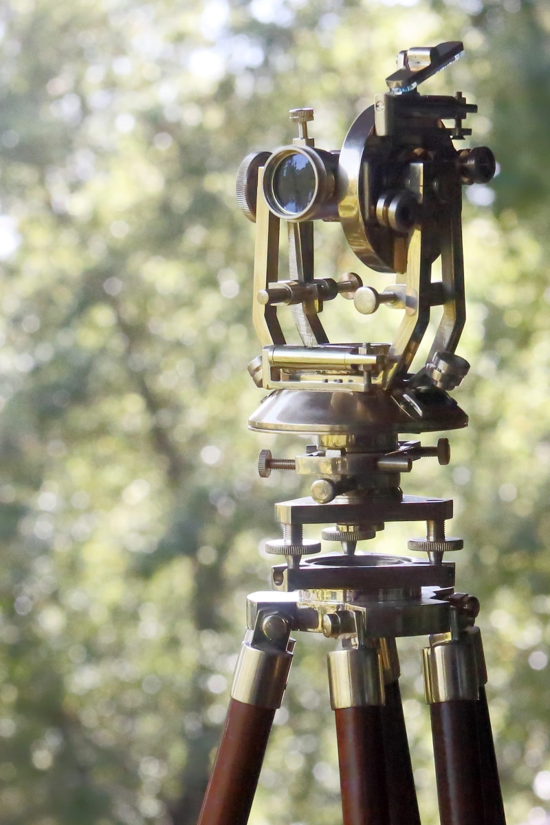 orientation, plant, cartography, exploration, explore, optical, old, equipment, tree, lens, no people, outdoors, survey, machinery, navigation, industry