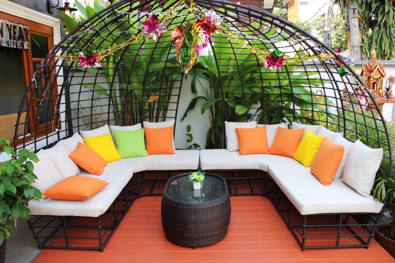 day, brick, empty, seat, orange color, cushion, patio furniture, surrounded, built structure, plant, nature, building exterior, patio, outdoor, chair, lifestyle