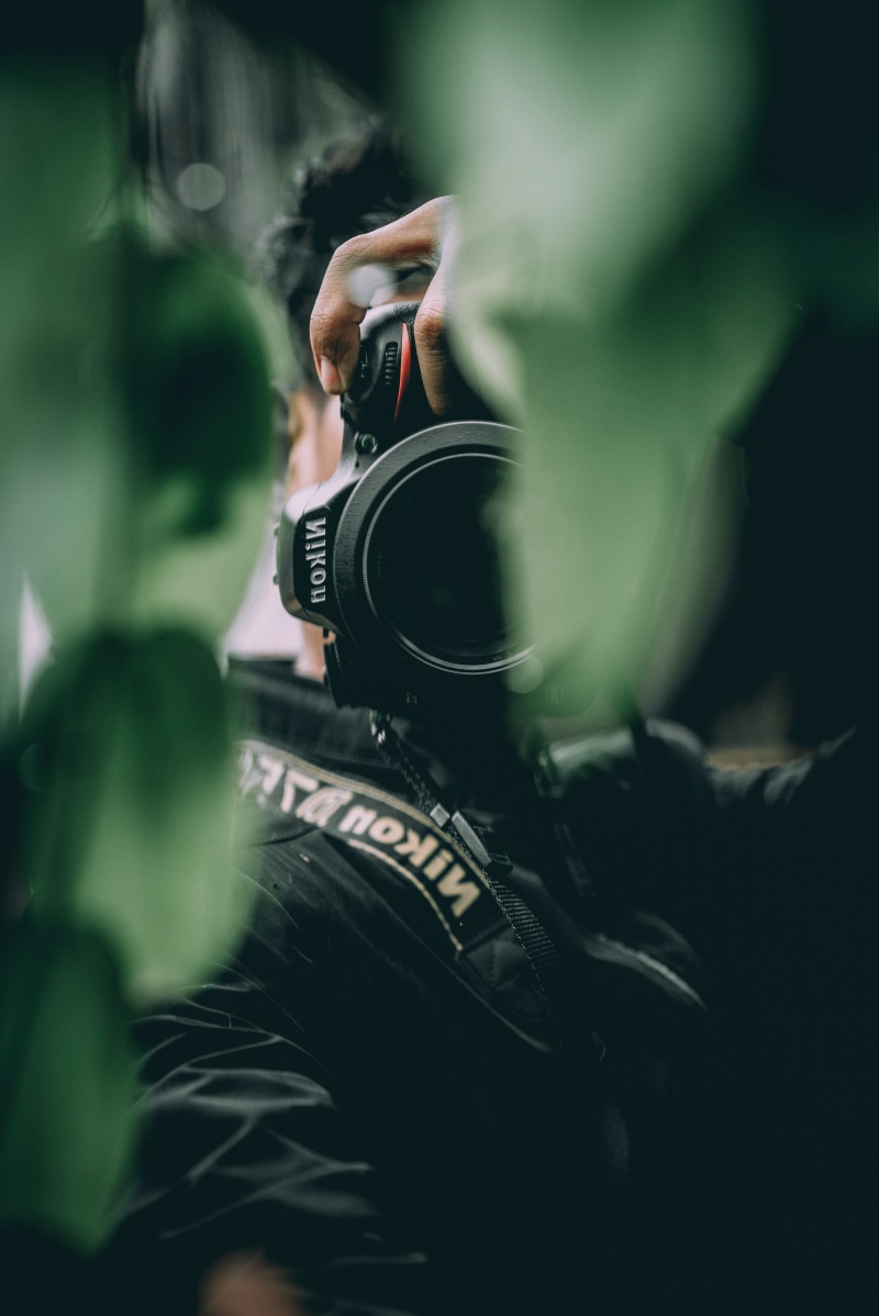 professional occupation, electronics, activity, lifestyles, holding, reflecting, two people, real people, bokeh, nikon d750, adult, selective focus, 50mm