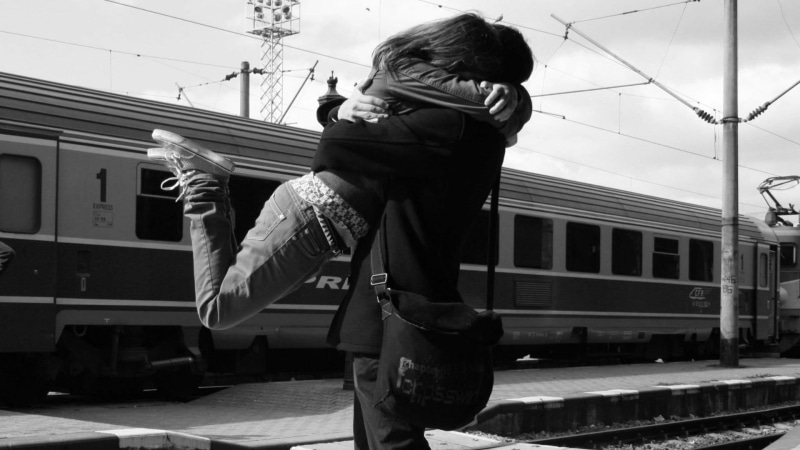 warm clothing, lovers, rail transportation, men, full length, childhood, day, males, real people, bliss, couple, lifestyles, one person, built structure
