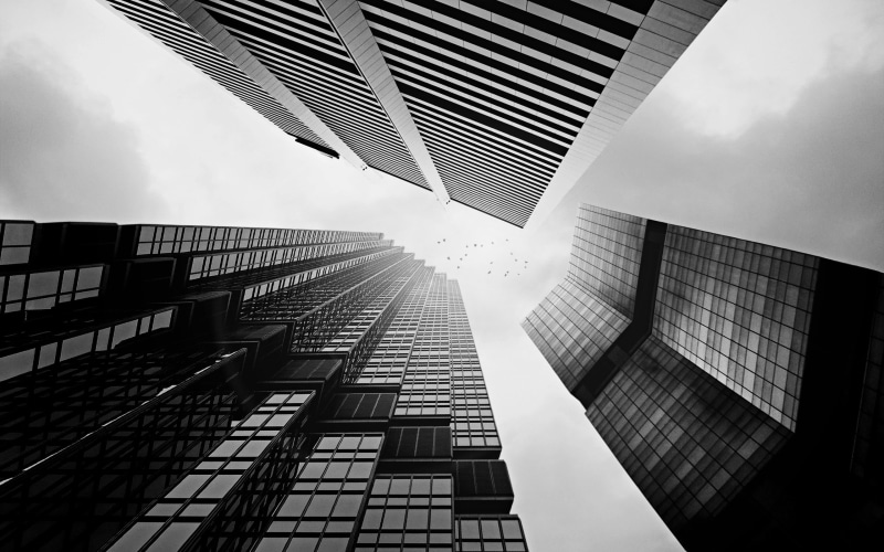 glass - material, financial district, no people, directly below, architecture, low angle view, day, tower, monochrome, built structure, building, skyscraper