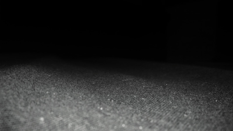 minimalism, arts culture and entertainment, flooring, textile, black background, 2K, indoors, dark, bed, pattern, textured, texture, surface level, no people
