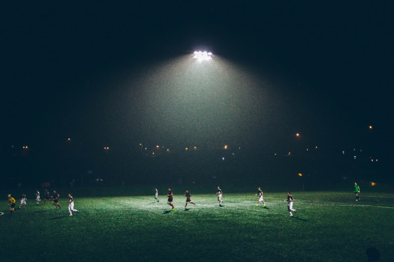 people, nature, grass, soccer, playing field, floodlight, cup, men, competition, illuminated, team sport, soccer field, night, stadium, leisure, play, soccer player