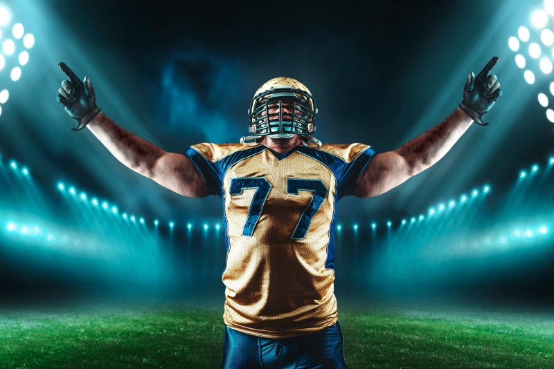 American football, stadium, field, player, 4K, floodlight, helmet, grass, male, t-shirt, sport, gloves, pose, athlete, uniform