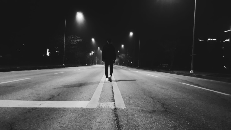 city, marking, rear view, walk, street, night, real people, road, architecture, sign, direction, alone, 5K, one person, illuminated, lighting equipment