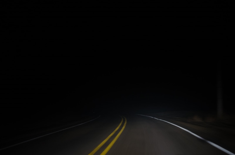 dividing line, gray, vanishing point, dark, road, no people, the way forward, nature, outdoors, double yellow line, highway, night, light, sign, street