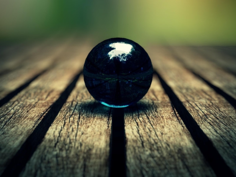 wood - material, sunlight, sphere, focus on foreground, wood, single object, shape, reflection, marble, no people, ball, 2K, still life, geometric shape