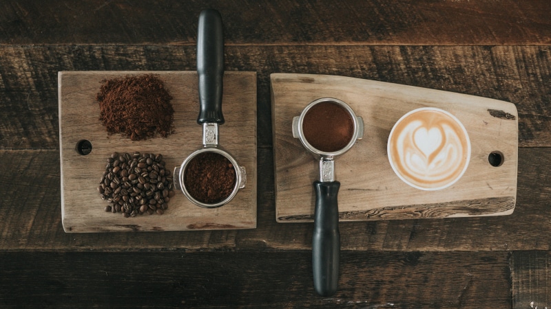 wood grain, cup, crockery, wood, latte art, ground coffee, freshness, refreshment, wooden surface, coffee, no people, ground coffee beans, coffee cup, wood - material