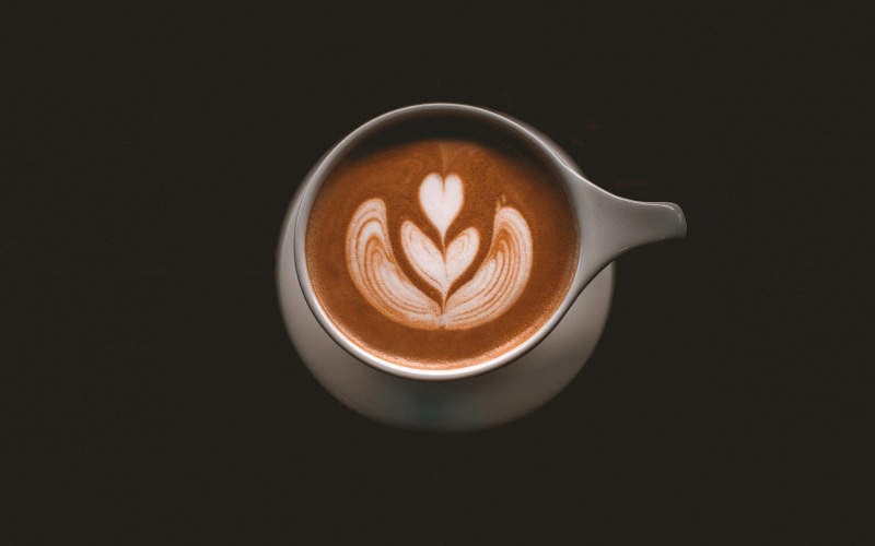 food, coffee cup, coffee mug, indoors, cream, breakfast, milk, coffee, foam, close-up, tableware, espresso, saucer, dark, coffee - drink, hot, cup of coffee