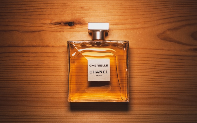 wood grain, healthcare and medicine, perfume, studio shot, bottle, text, container, communication, clear, chanel, 4K, label, cologne, wood - material