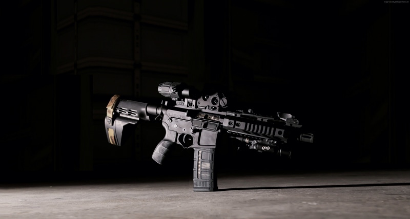 table, weapon, wall - building feature, front view, indoors, surveillance, gun, no people, security, skill, robot, accuracy, aggression, studio shot, communication
