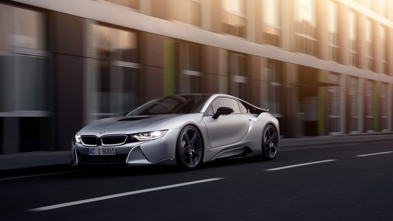 travel, on the move, outdoors, luxury, street, silver, motion, built structure, sports car, blurred motion, bmw, city, mode of transportation, BMW i8, motor vehicle