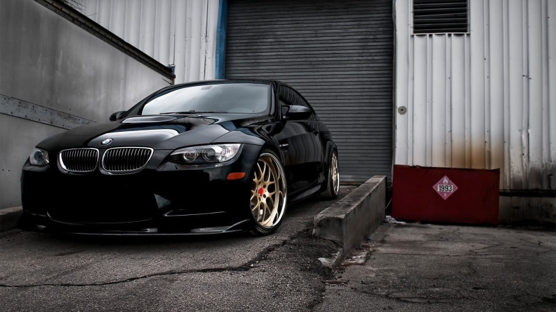 building exterior, sports car, transportation, car, BMW, wall - building feature, garage, stationary, retro styled, built structure, city, wheel, black cars
