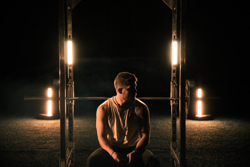 working out, lifestyles, back, wooden, man, healthy lifestyle, exercising, shorts, fitness, bench, lights, night, young adult, contemplation, candle, three quarter length
