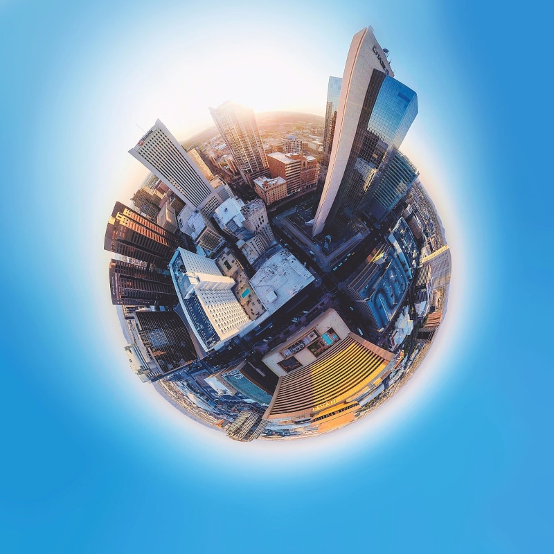 outdoors, lens, flat earth, reflection, built structure, eye, building, financial district, office building exterior, sky, building exterior, city, bright