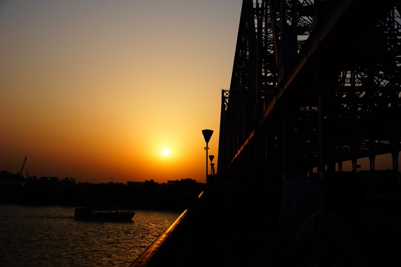 howrah bridge, 5K, transportation, bridge, river, city, building exterior, clear sky, nature, no people, india, howrah, outdoors, sky, orange color, silhouette