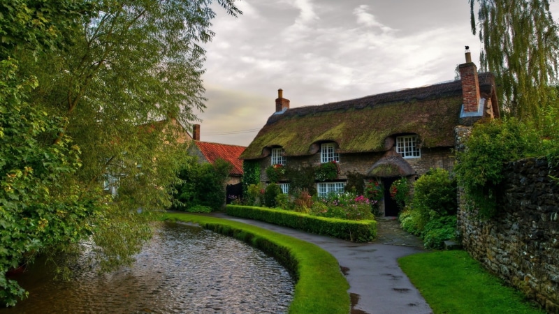water, building, green color, landscape, architecture, cloud - sky, 1080P, outdoors, building exterior, residential district, sky, house, architecture house nature trees branch ireland stone house road street village clouds chimneys walls wet stones flowers sidewalks plants grass