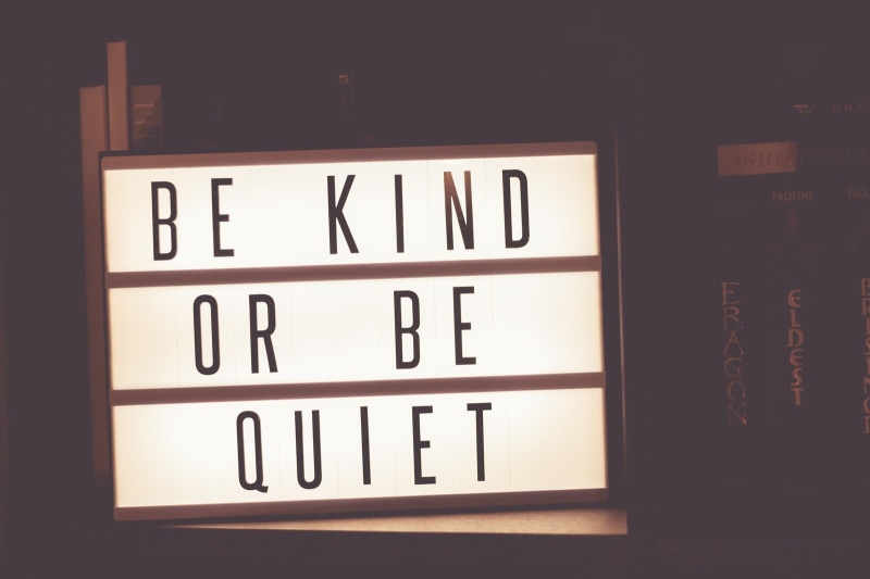 single word, quiet, typography, indoors, close-up, wood - material, dark, communication, alphabet, black color, kind, wall - building feature, text, signage