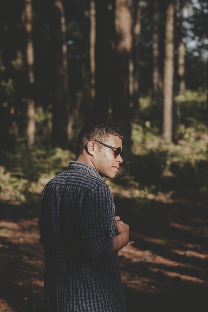 outerwear, tree, one person, daylight, land, nature, near, trees, tall, fashionable, casual clothing, plant, young adult, colors, landscape, lifestyles