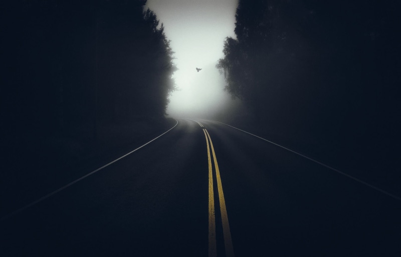 double yellow line, traffic, nature, road, empty, outdoors, direction, fog, street, blue, dark, no People, trees, travel, cloud - Sky, long, landscape