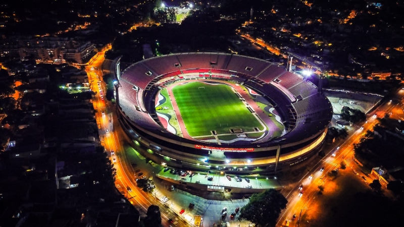 building, landscape, arena, scenery, high angle view, outdoors, night, nature, circle, vehicle, av. giovanni gronchi, field, transportation, person, team sport