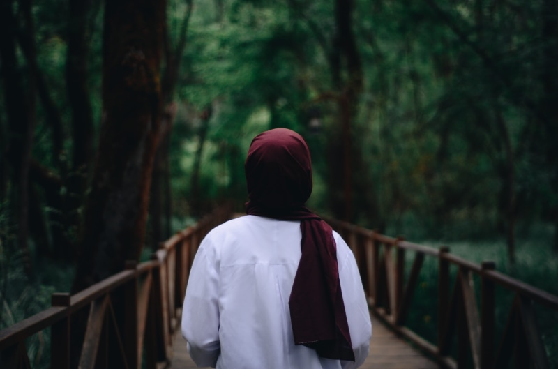 woman, focus on foreground, forest, wearing, outdoors, wear, lifestyles, land, clothing, casual clothing, plant, railing, one person, red, person, rear view