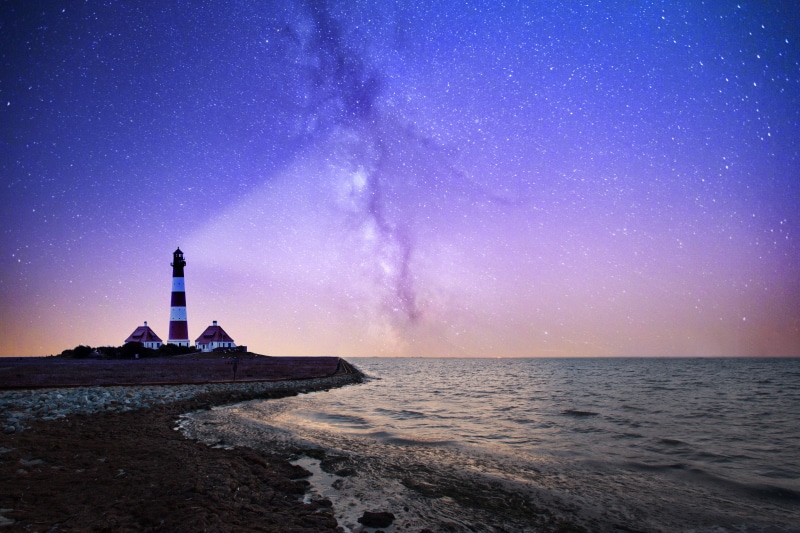 star - space, sky, no people, built structure, astronomy, tower, coastline, white, bodies, famous Place, LIGHTHOUSE, beauty in nature, rock, lighting Equipment