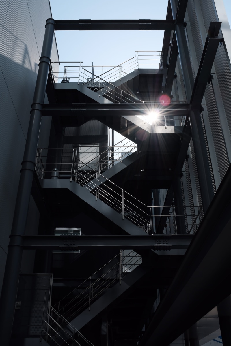bridge - man made structure, light, building, street, stairs, connection, apartment, banister, metal, day, skylight, no people, outdoors, staircase, flare
