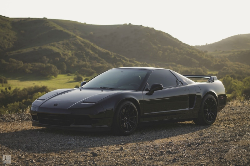 outdoors, car, day, sky, 2K, non-urban scene, mountain range, acura, JDM, sunlight, land, no people, transportation, clear sky, luxury, environment, mode of transportation