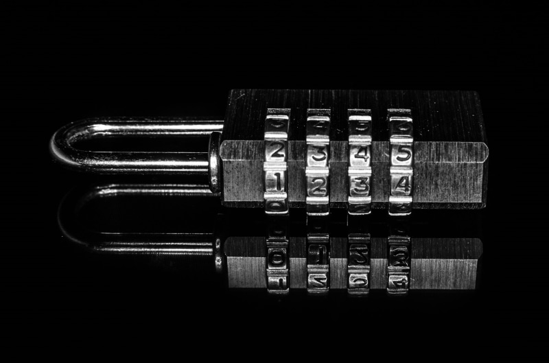 technology, studio shot, still life, password, communication, table, secure, metal, finance, security, single object, in a row, lock, secret, number, black background