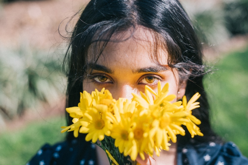 flowers, hairstyle, plant, yellow, close-up, retro, vintage, one person, fragility, child, aesthetics, flowering plant, human face, freshness, innocence