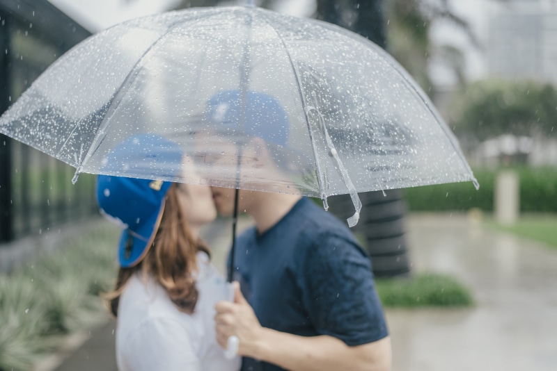man, rainy season, bonding, people, couple, wet, security, rain, outdoors, day, real people, umbrella, females, two people, safety, 5K, weather, childhood