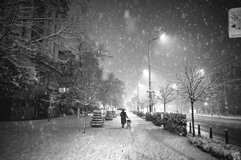 walking, person, outdoors, winter, snow, storm, nature, extreme weather, building, black and white, snowing, night, transportation, weather, the way forward