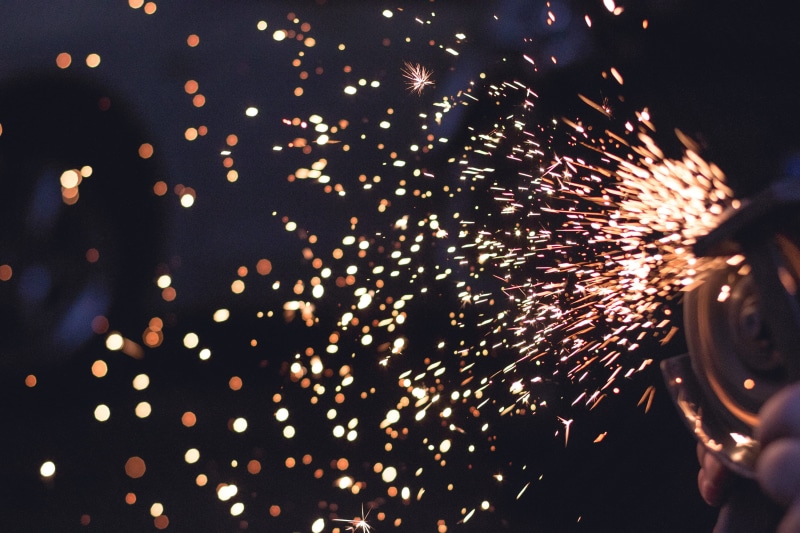 burning, nighttime, firework - man made object, illuminated, spark, exploding, bokeh, grinding, bright, arts culture and entertainment, outdoors, light