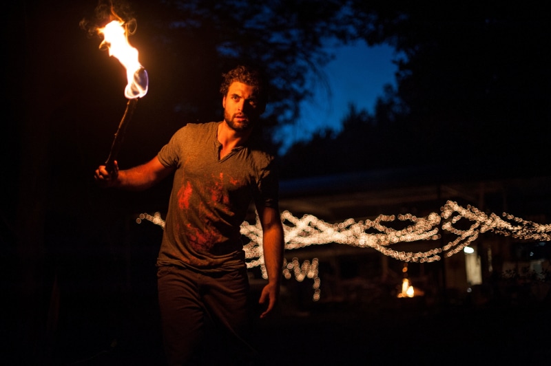 standing, fire - natural phenomenon, performance, illuminated, sign, three quarter length, light, dark, bokeh, warning sign, nightlife, sparkler, torch