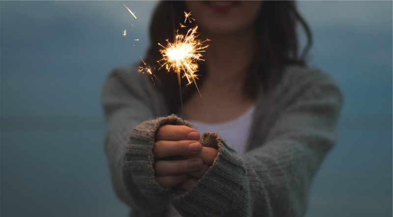 warm clothing, Sweater, illuminated, adult, gray, motion, New Year, standing, Holding, Year, one person, focus on foreground, leisure activity, cardigan