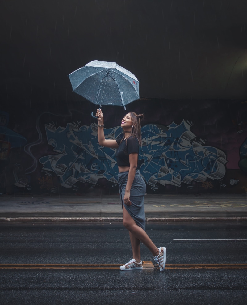 lifestyles, wet, women, front view, real people, full length, care, wear, umbrella, security, standing, casual clothing, woman, holding, rain, one person
