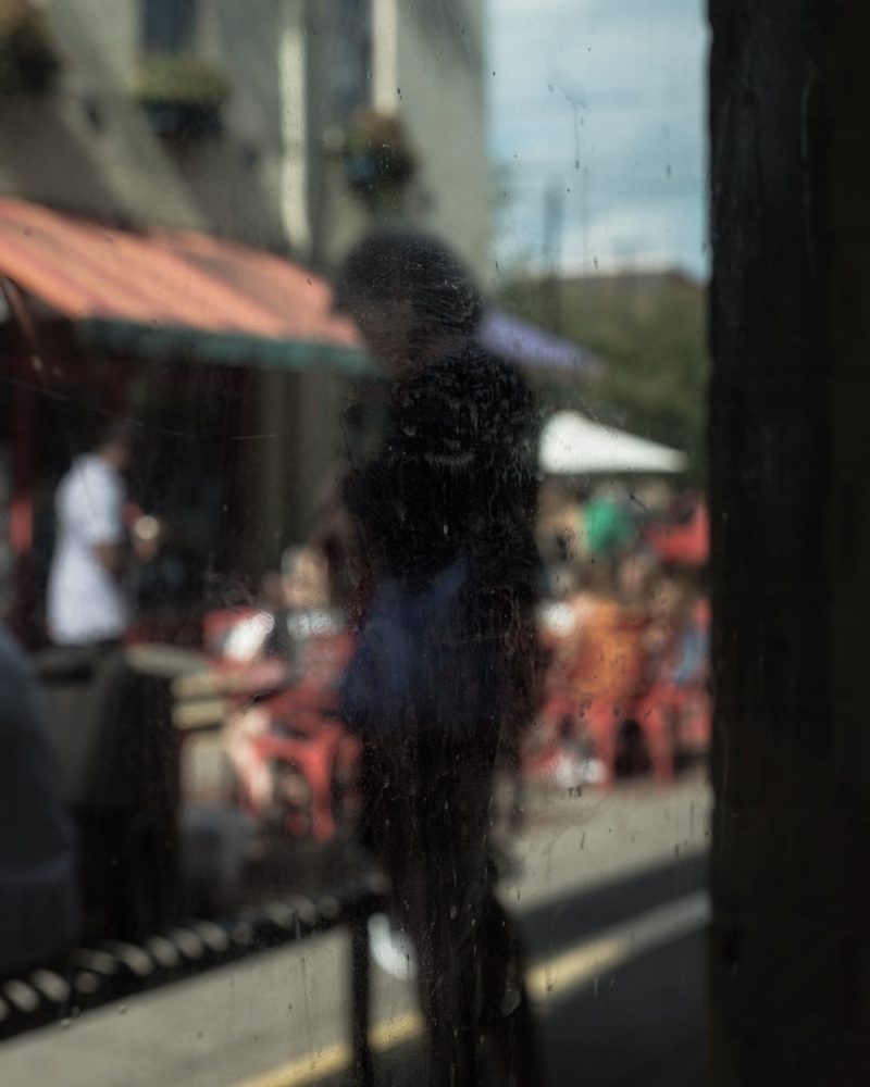 sphere, shorts, glass, pedestrian, machine, apparel, building exterior, glass - material, swimwear, road, incidental people, architecture, walking, city street