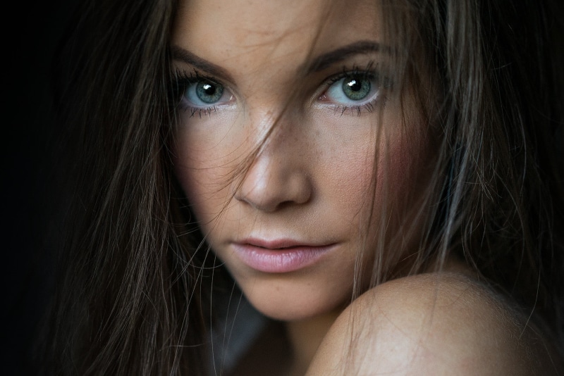 close-up, black background, beauty, human face, indoors, hairstyle, one person, beautiful woman, teardrop, contemplation, 1080P, hair, headshot, freckles