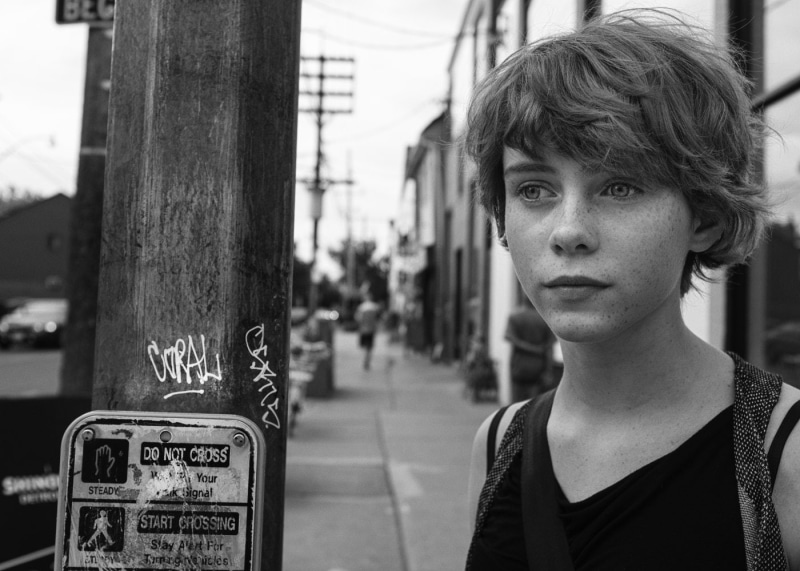 actress, leisure activity, looking away, day, real people, portrait, pre-adolescent child, boys, lifestyles, architectural column, women outdoors, monochrome