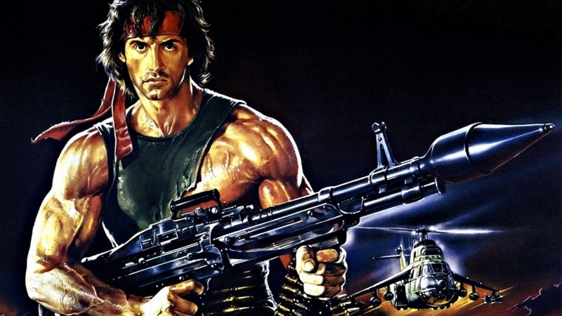 indoors, studio shot, clothing, aggression, standing, serious, government, one person, holding, black background, Rambo, Rambo: First Blood Part II, arts culture and entertainment