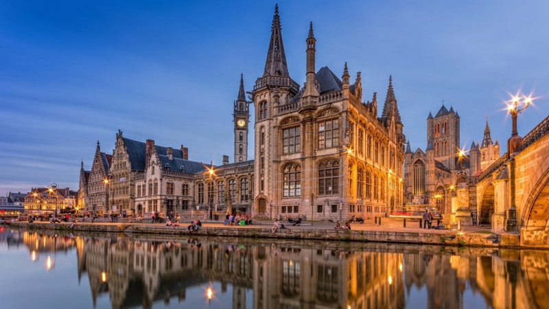 religion, cathedral, dusk, river, waterfront, building exterior, sky, basilica, reflection, building, landmark, belgium, nature, tower, travel destinations