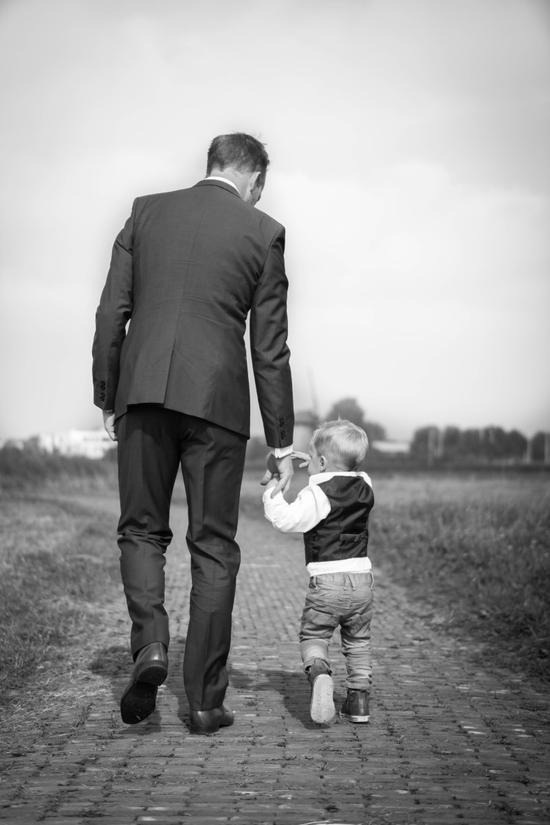 full length, males, day, family with one child, little, nature, toddler, love, outdoors, positive emotion, bonding, childhood, contrast, holding hand, suit