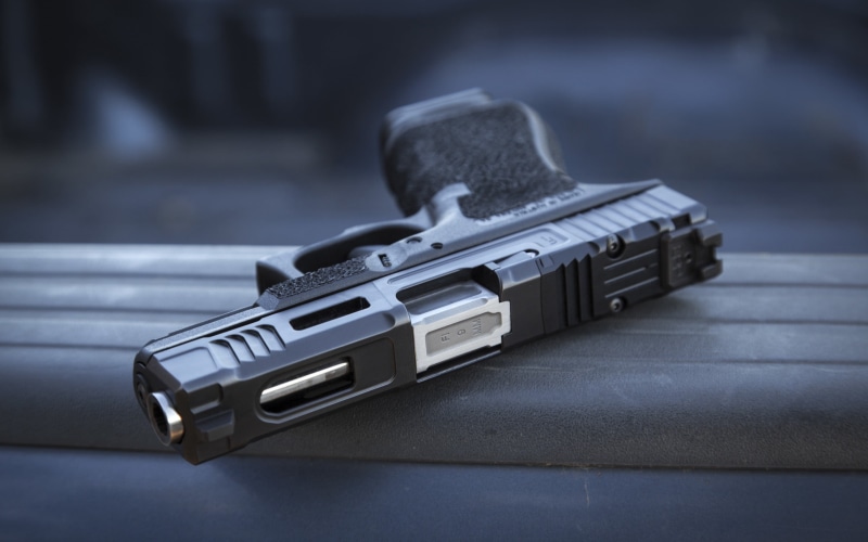 aggression, communication, pistol, war, social issues, ammunition, focus on foreground, conflict, gray, 2K, black, security, semi, background, gun, crime