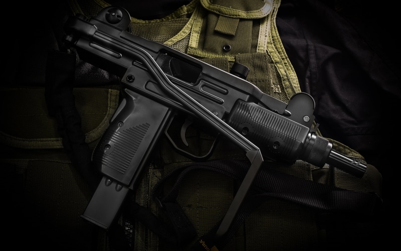 uzi, sign, black, War and Army, Handgun, machine gun, social issues, one person, gun, violence, rifle, safety, weapon, warning sign, black color, communication