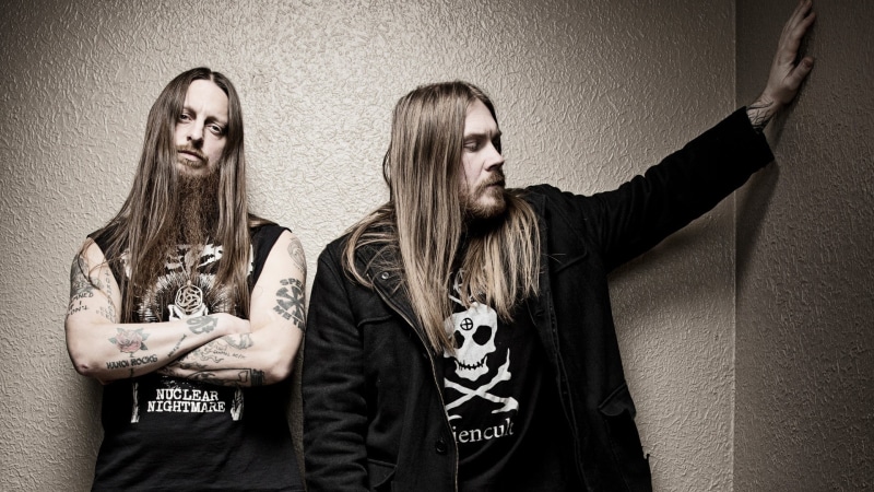 metal music, wall - building feature, metal band, rock music, hairstyle, waist up, black metal, portrait, young adult, rock bands, leisure activity, sister
