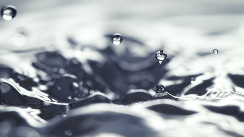 surface level, refreshment, water drops, abstract, purity, no people, drop, food and drink, silver colored, macro, indoors, close-up, splashing, backgrounds