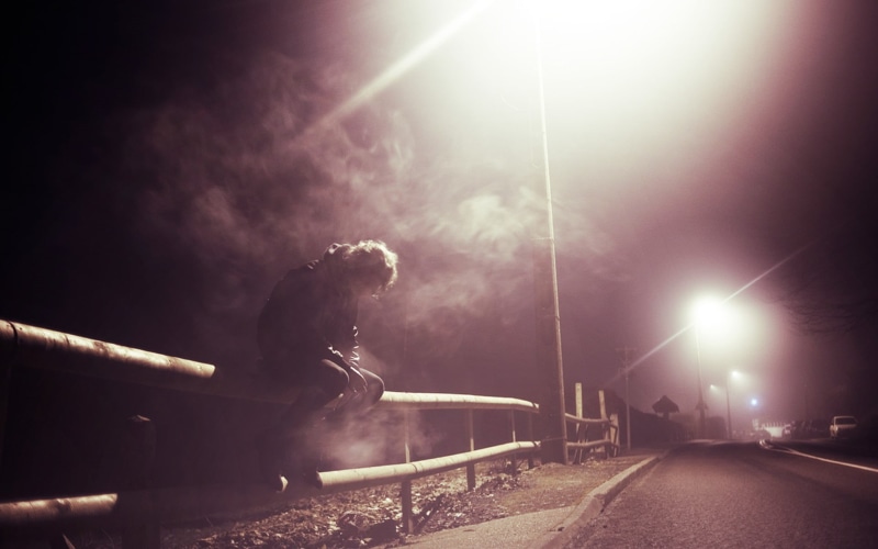 lens flare, mode of transportation, built structure, architecture, sky, sad, illuminated, fence, night, motion, transportation, city, smoking, outdoors