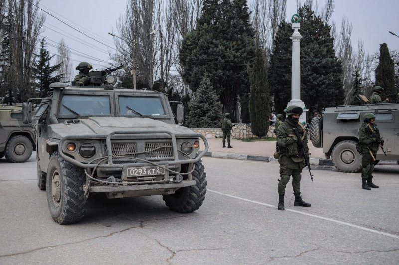 government, plant, men, land vehicle, day, vehicle, road, full length, soldier, motor vehicle, tree, military, mode of transportation, uniform, car, one person